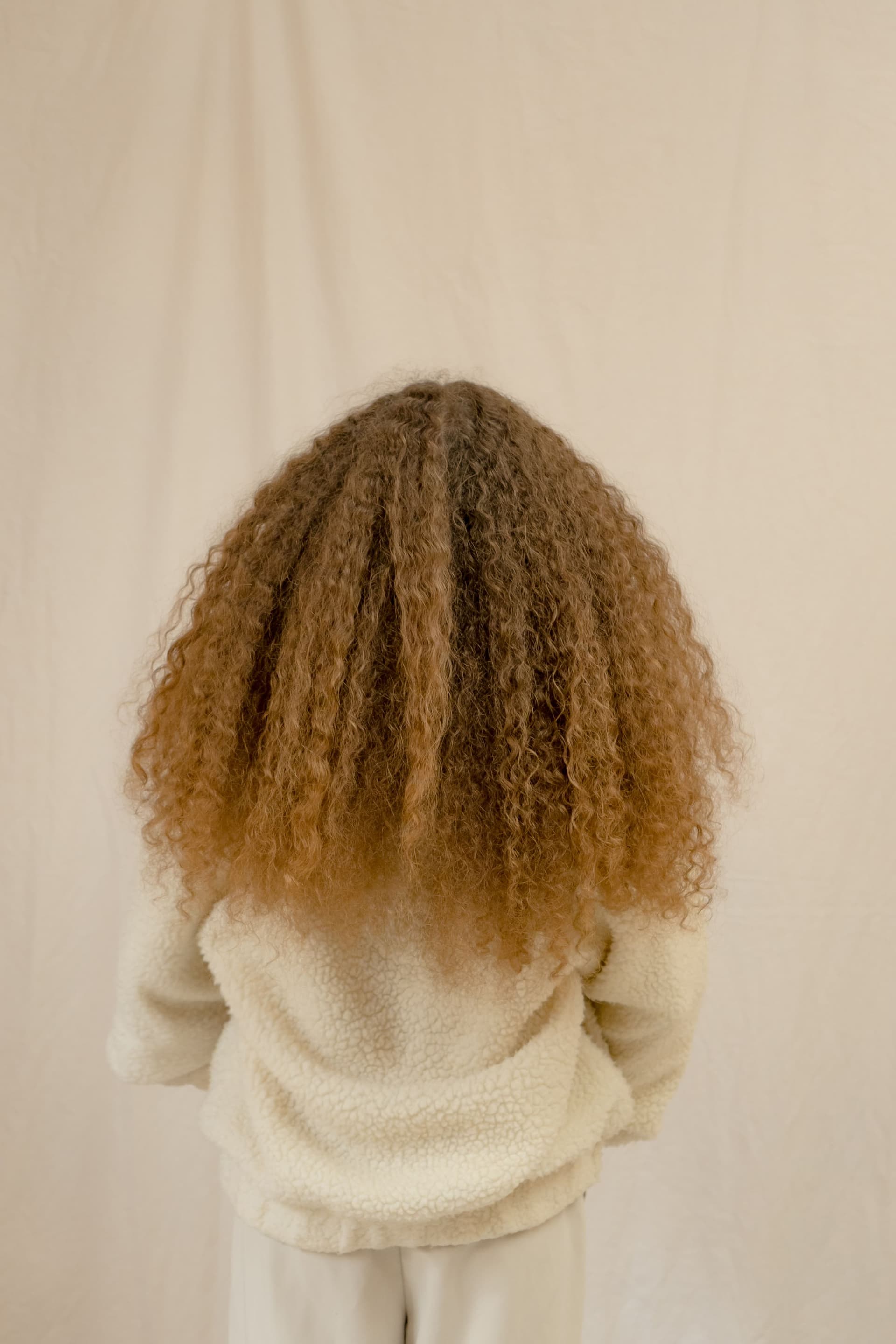 Stylist working on a protective style